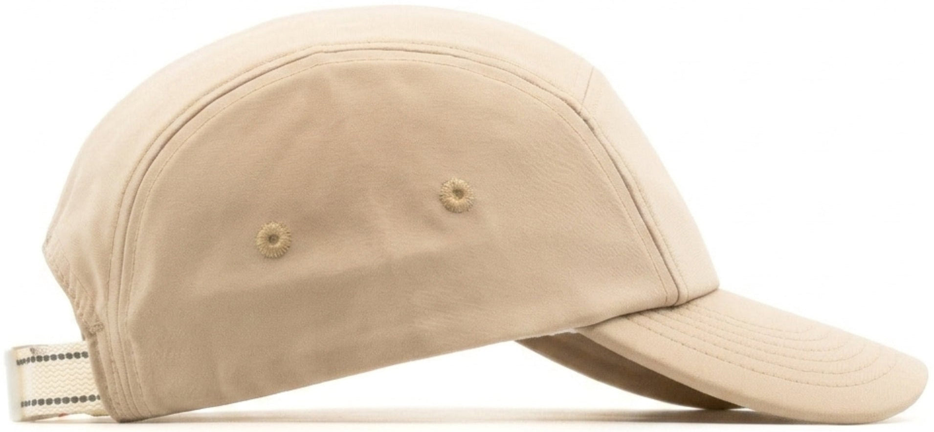 The CORE Performance Cap in Sand / Reflective features breathable fabric, a curved brim, side ventilation eyelets, and an adjustable back strap. It is displayed on a white background.