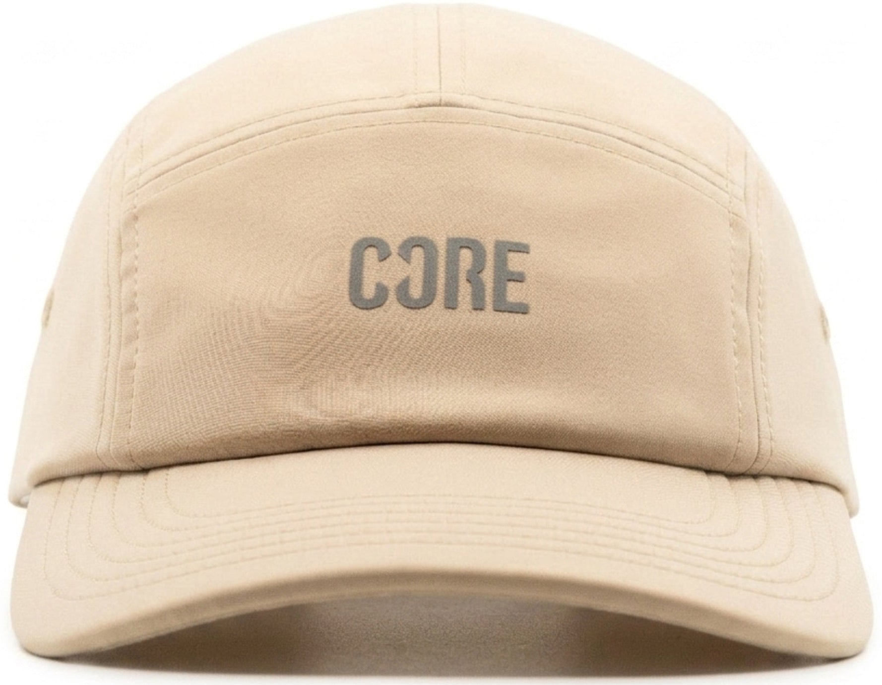 The CORE Performance Cap - Sand / Reflective by CORE features the word “CORE” in reflective gray uppercase letters on the front panel, crafted from breathable fabric and displayed against a white background.