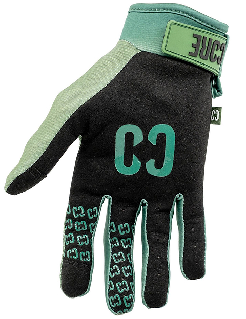 Introducing the CORE Pro-Fit Velcro Skate Protection Gloves in Army Green: these black and green gloves feature “CORE” branding on the back and along the fingers, as well as a vibrant green wrist strap with a secure Velcro closure—ideal for use as scooter gloves or riding gloves.