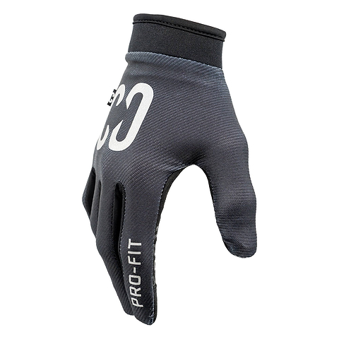 A pair of CORE Pro-Fit Velcro Skate Protection Gloves in reflective black, featuring “PRO-FIT” on the index finger and white “CO” branding on the back, shown worn on a hand against a white background—ideal as BMX or riding gloves.