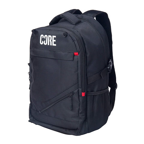 The CORE Scooter Skate Helmet Backpack - Black features multiple zippered compartments, red accent tabs, side pockets, a hidden zip pocket, and “CORE” in white on the front.