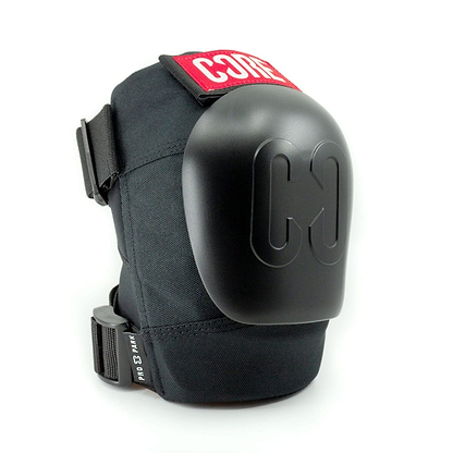 A black pair of CORE Pro Park Knee Skate Protection Pads featuring a hard shell cover and adjustable straps, ideal for skatepark riders. The product prominently displays the "CORE" brand name in striking red and white on the upper part, alongside a distinctive "C3" logo on the shell, offering dynamic size system customization for an optimal fit.