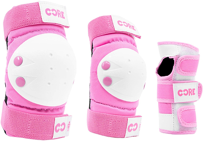 The CORE Junior Triple Skate Protection Pad Set - Pink includes three pieces of protective gear—knee pad, elbow pad, and wrist guard—all featuring the CORE logo and adjustable Velcro straps, providing essential safety for young skaters or bikers.