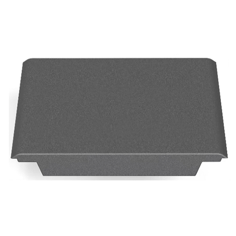 A rectangular, dark gray metal object with a flat top and curved edges, resembling the CORE Mini Funbox Ramp Set by CORE, is viewed from above against a white background.