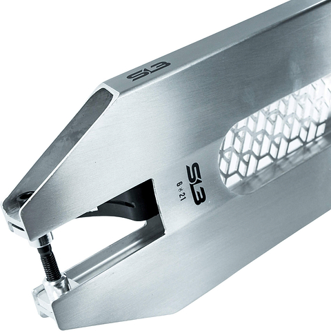Close-up of a metallic tool with a hexagonal cut-out design, labeled “SB,” featuring a screw mechanism at one end, likely used for clamping or fastening objects—its forged polished finish reflects the durable engineering found in the CORE SL3 Forged Polished Stunt Scooter Deck (6″ x 21″) by CORE.