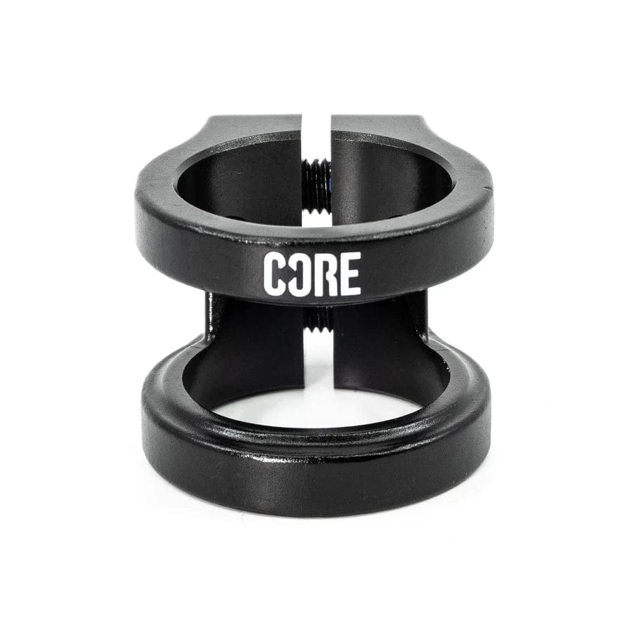 The CORE Venom 2 Bolt Oversized Stunt Scooter Clamp in black is designed for scooters and features the distinctive "CORE Venom 2" logo in white. It includes two circular openings and a central bolt for effectively securing the handlebars or stem.