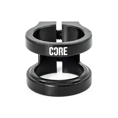 The CORE Venom 2 Bolt Oversized Stunt Scooter Clamp in black is designed for scooters and features the distinctive "CORE Venom 2" logo in white. It includes two circular openings and a central bolt for effectively securing the handlebars or stem.