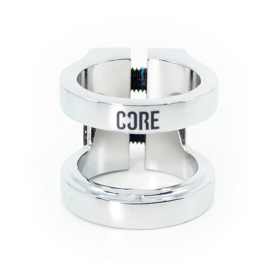 The CORE Venom 2 Bolt Oversized Stunt Scooter Clamp, crafted from chrome CNC machined aluminum, showcases the engraving "CORE." This sleek and polished clamp features a split design with two prominent screws, all displayed against a white background.