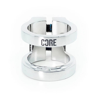 The CORE Venom 2 Bolt Oversized Stunt Scooter Clamp, crafted from chrome CNC machined aluminum, showcases the engraving "CORE." This sleek and polished clamp features a split design with two prominent screws, all displayed against a white background.