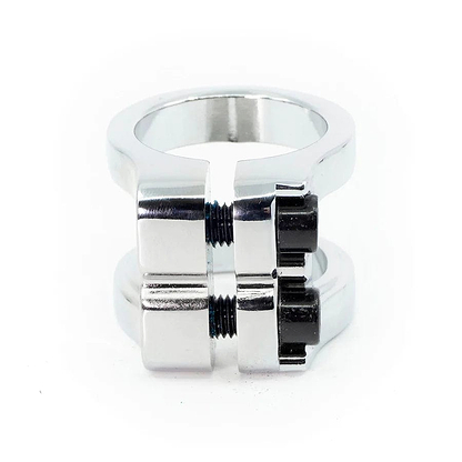 The CORE Venom 2 Bolt Oversized Stunt Scooter Clamp by CORE features a chrome finish and includes two black bolts for secure fastening. Its lightweight design elegantly encircles the scooter, providing both functionality and style.