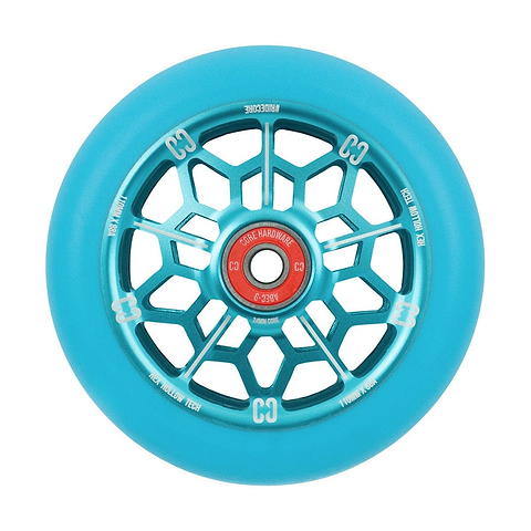 A detailed view of the CORE Hex Hollow Core 110mm Stunt Scooter Wheel in Mint Blue highlights its distinctive honeycomb design and HEX Hollow Technology within the spokes. The silver hollow core features red accents, while white markings around the rim enhance its sleek appearance, promising smooth rides with ABEC 9 bearings.