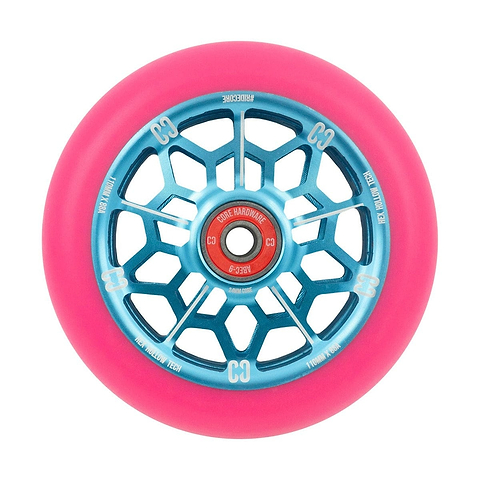 The CORE Hex Hollow Core 110mm Stunt Scooter Wheel in vibrant pink and blue features a web design with blue metallic spokes and an 88a compound for superior grip. The red central hub is detailed with text and logos, while the ABEC 9 bearings ensure a smooth ride. Its Hex Hollow Core enhances performance on any stunt scooter.