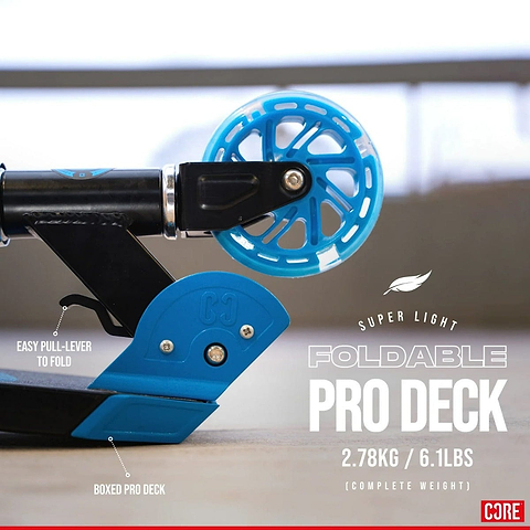 Close-up of the rear wheel and deck of the CORE Foldy Kids LED Foldable Scooter in black and blue, showcasing an easy pull-lever for folding and a boxed pro deck. Weighing just 2.78 kg (6.1 lbs), this scooter features an adjustable handlebar, making it perfect for kids.