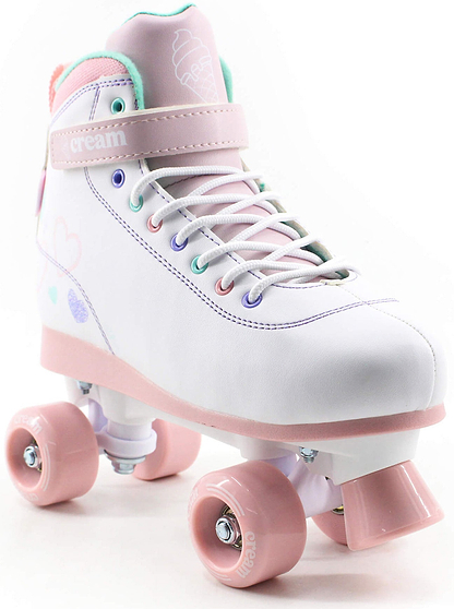 Introducing the CREAM Scoop Hearts Adjustable Quad Roller Skates in White and Pink—these playful vegan leather skates feature a high-top lace-up design, soft pink wheels, and an adjustable ankle strap adorned with an ice cream cone graphic. The sides are decorated with small colorful hearts and a cheerful pastel pattern, making them perfect beginner skates for fun outings.