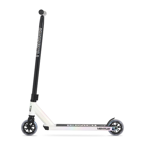 The Legacy Ventus Complete Stunt Scooter in White Glitter features two small wheels, a long black handlebar, and "LEGACY" branding on the frame, shown against a plain white background.