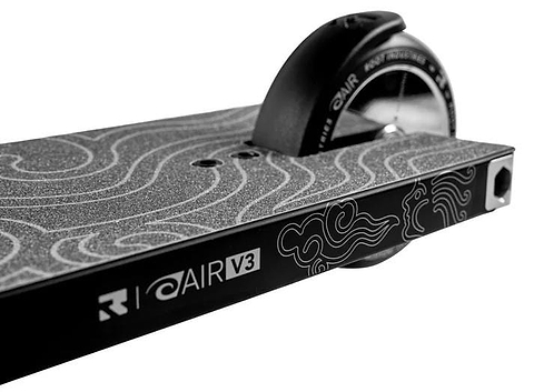 Close-up of the Root Industries AIR RS V3 Complete Stunt Scooter - Black, showing its deck with a textured grip, cloud patterns, and "AIR V3" label near the rear wheel.