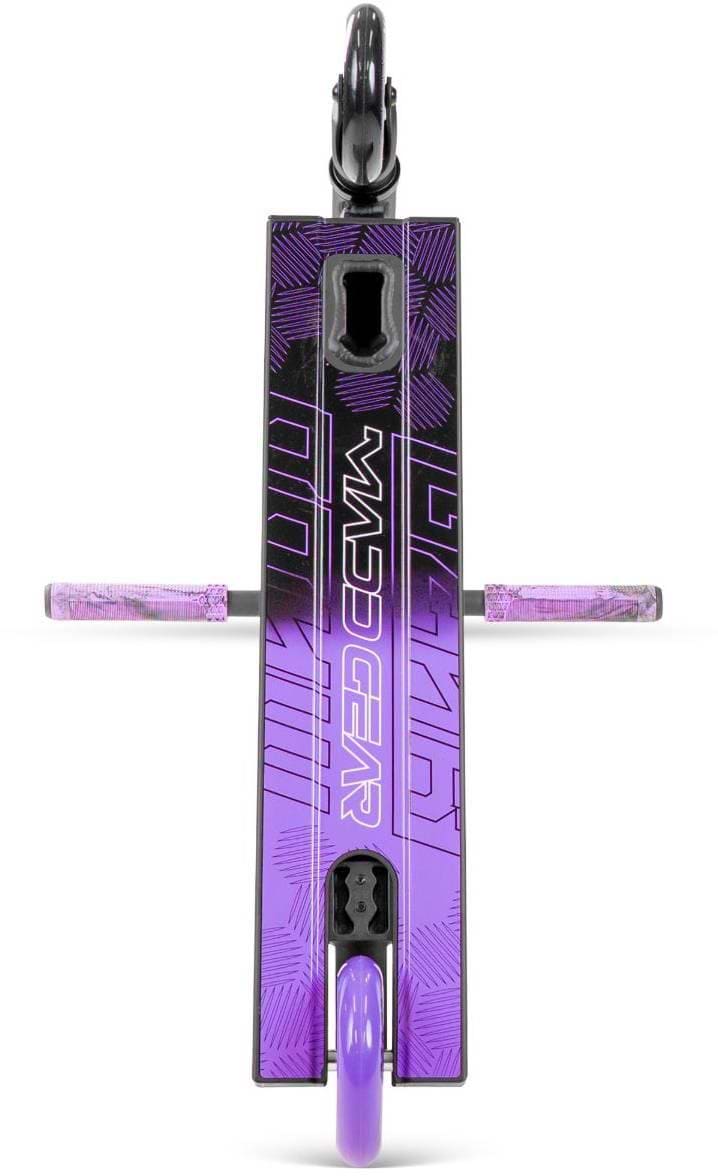 A top-down view of the Madd Gear MG 3 Zen Complete Stunt Scooter - Black / Lavender by MGP displays "MADD GEAR" on the deck with geometric patterns, handle grips on either side, and both wheels visible in sleek black and lavender tones.