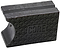 A liquorice black metal object featuring a hexagonal pattern on its surface and the "CORE" logo embossed in the center resembles pre-grooved shapes. The piece has a grooved top edge and a smooth, curved side, exuding an industrial look similar to CORE Epic Skate Wax.
