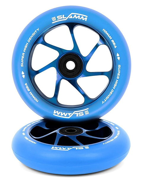 Two Slamm Team 110mm stunt scooter wheels in blue with high-density PU, tough aluminium cores, and "Super High Density" text. One wheel stands upright, the other lies flat. Black spokes and white branding complete the design.