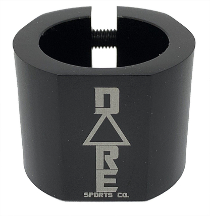 The Dare Warlord 2 Bolt Standard Stunt Scooter Clamp in black, crafted by Dare, is a CNC machined, lightweight metal clamp featuring a hexagonal shape with an engraved "Dare" name and a slit for tightening. It offers exceptional grip and durability, making it perfect for extreme sports enthusiasts.