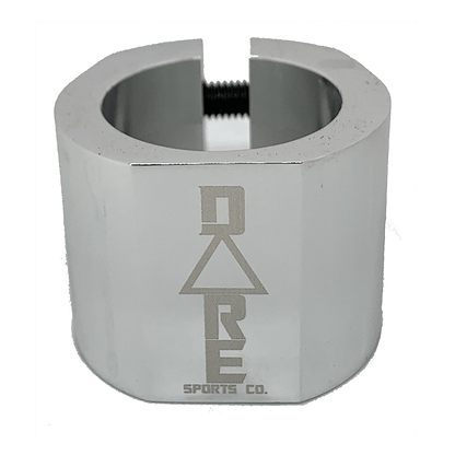 The Dare Warlord 2 Bolt Standard Stunt Scooter Clamp in chrome is depicted with a CNC machined finish and a hexagonal design. The clamp, made by Dare, has an engraved logo reading "DARE Sports Co." and features a visible screw on top for tightening or fastening. It is shown against a white background.