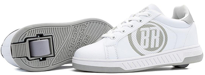 A pair of Breezy Rollers Classic Shoes in White/Grey, featuring a large "RR" logo and a patented wheel system in the sole. One shoe stands upright while the other rests on its side to display the unique wheels.