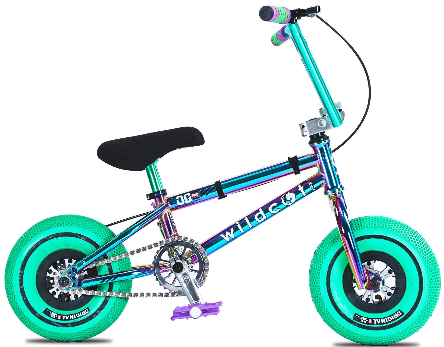 The Wildcat OG Pro Mini BMX Bike - Joker Green features a metallic blue and purple frame, bright green tires, black seat, purple pedals, Turbo wheel design, and "wildcat" branding on the frame.