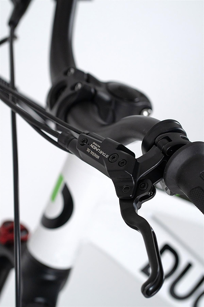 Close-up of the Duo 16" Master Pro Kids Electric Balance Bike’s handlebar and brake lever with visible cables, a partial Duo logo on the white frame, and black grip—ideal for young riders.