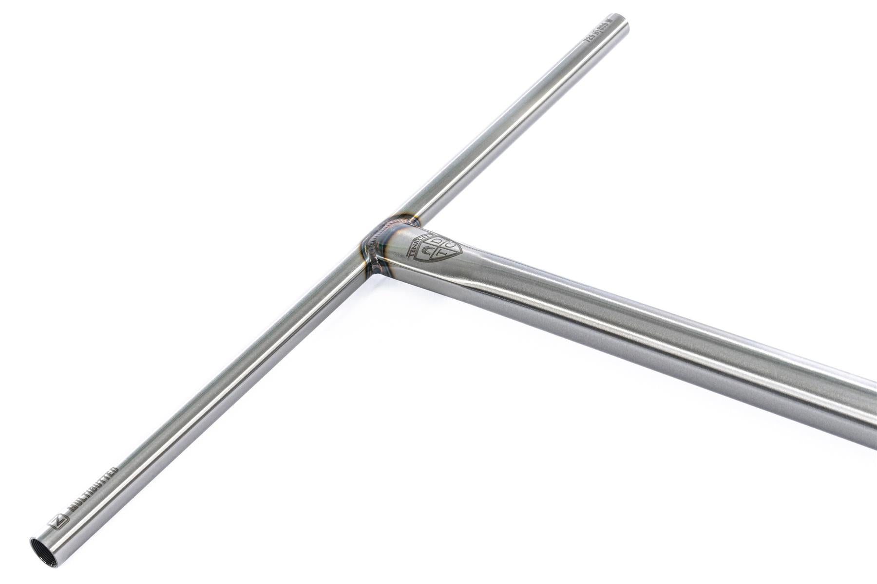 The Ethic DTC Tenacity V2 Steel Oversized HIC Stunt Scooter T-Bars feature a raw metal T-shape, reinforced welded center joint, small logo at the junction, and measure 620mm x 600mm.