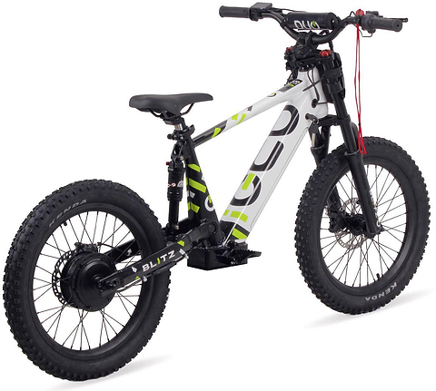 The Duo 20" Blitz Kids Electric Balance Bike by Duo, in white and black with green accents, features thick tires, front suspension, and disc brakes. It is shown photographed on a white background.