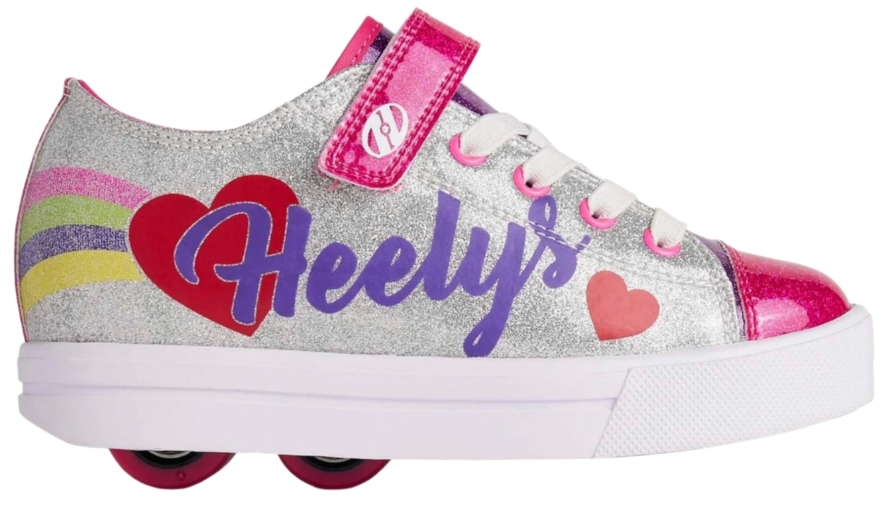The Heelys Snazzy X2 Girls Shoes in silver feature rainbow stripes, red hearts, pink accents, purple "Heelys" branding, ABEC 3 bearings, pink wheels, white laces with pink eyelets, and a durable synthetic upper.