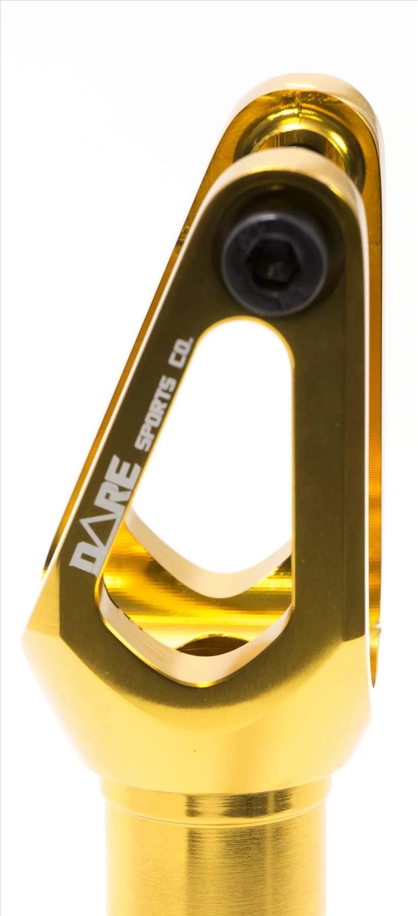 Close-up of the Dare Dimension IHC Stunt Scooter Forks in gold by Dare, showing the shiny CNC-machined aluminium, black bolt, "DARE SPORTS CO." engraving, IHC compression system, sleek design, and metallic finish.