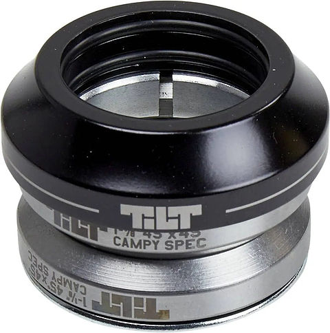 A close-up of the Tilt Tall Stack Integrated Stunt Scooter Headset in black by Tilt, featuring precision-sealed campy spec bearings and an integrated spacer for smooth scooter steering.