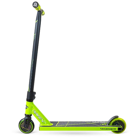 The Madd Gear MG 1 Raven Complete Stunt Scooter in lime and black features a narrow deck, small wheels, striped handlebars, and "MADD" on the footboard. The kids scooter stands upright on a white background.