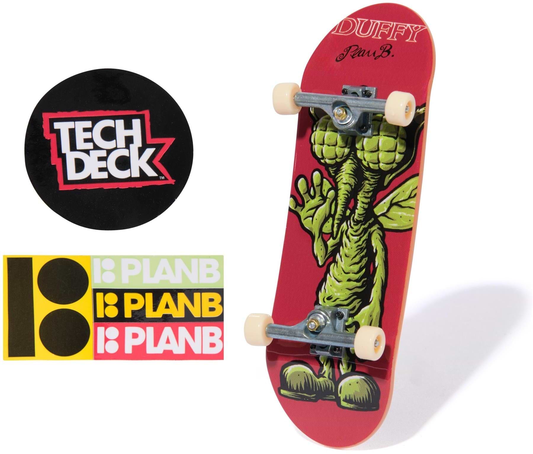 The Tech Deck 96mm M57 Fingerboard - Plan B features a green monster graphic, silver trucks, white wheels, a round Tech Deck logo sticker, and three Plan B stickers—ideal for fans of 96mm fingerboards and collectible skateboards.