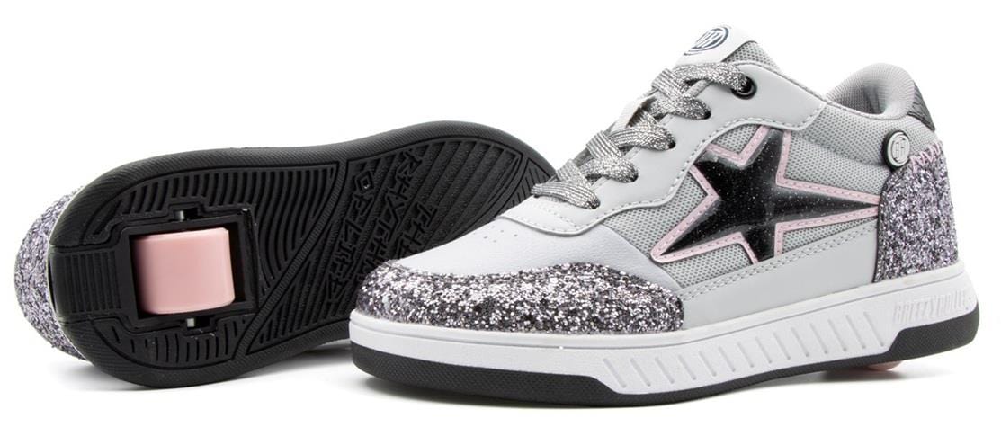 The Breezy Rollers Star Shoes - Silver / Grey feature a black star, white and silver glittery finish, and a patented retractable wheel in one sole for easy skating. Brand: Breezy Rollers.
