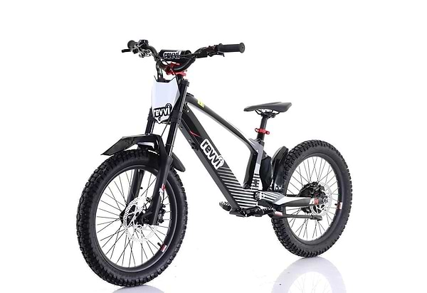 The Revvi 20" Kids Electric Balance Bike - Black features thick off-road rubber air-filled tires, a sturdy frame, front suspension fork, rear coil shock absorber, and a branded front plate. Its sporty design is ideal for trail riding.