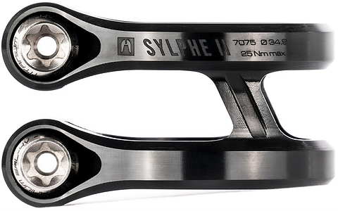 Close-up of two Ethic DTC Sylphe V2 2 Bolt Oversized Stunt Scooter Clamps in black, showing "SYLPHE II" label, visible engravings like "7075 Ø34.9," and "25 Nm max" on the lightweight clamp by Ethic.