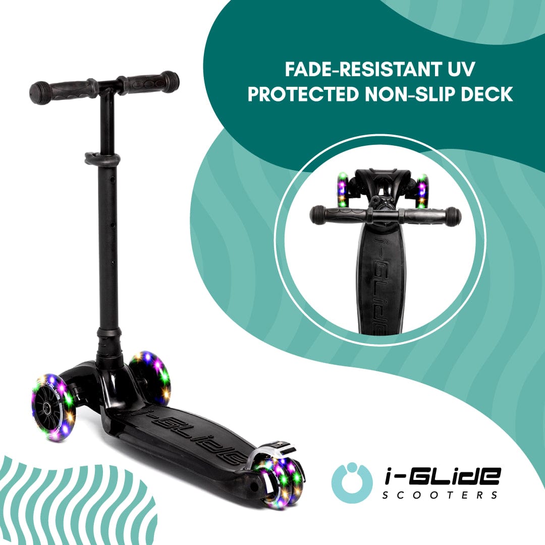 A black i-Glide 3-Wheel LED Kids Scooter is showcased against a teal wave-patterned backdrop, featuring dazzling LED wheels. Above the I-Glide logo, the text announces "Fade-Resistant UV Protected Non-Slip Deck." Ideal for kids who enjoy stylish rides!