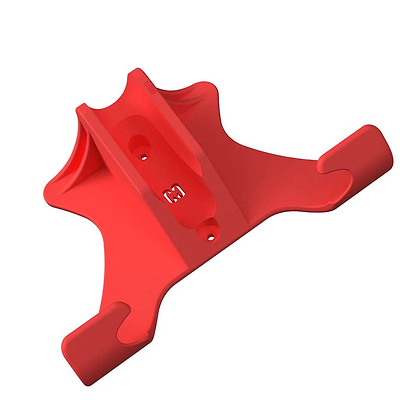 Introducing the CORE Scooter Wall & Floor Stand by CORE, a distinctively designed red plastic holder featuring a central cavity for attachment and two extended arms. This adaptable wall stand boasts an array of curves and angles, complete with visible surface markings.
