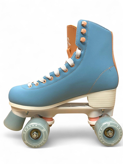 The Supreme Malibu Quad Roller Skates - Light Blue feature retro styling with white laces, tan accents, four light blue wheels, a blue toe stop, and a white sole—ideal for beginners or recreational skating.