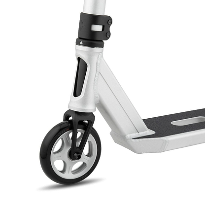 A close-up of the Drone Element 2 Feather-Light Complete Stunt Scooter in Silver Anodized highlights its front wheel and deck. The black Luxe 3 Dual-Core Wheel features stylish white spokes, and the deck is equipped with a textured grip surface. Its frame, with a sleek metallic finish, is accented by an IHC aluminum fork for smooth riding.