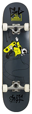 The Enuff Skully Black Complete Skateboard - 7.75" x 31.5" features a striking black deck adorned with a cartoon character in a dynamic pose, sporting a yellow outfit. Enhanced by bold, stylized text at the top and bottom, this skateboard is equipped with premium components such as white wheels and silver trucks, making it ideal for beginners.