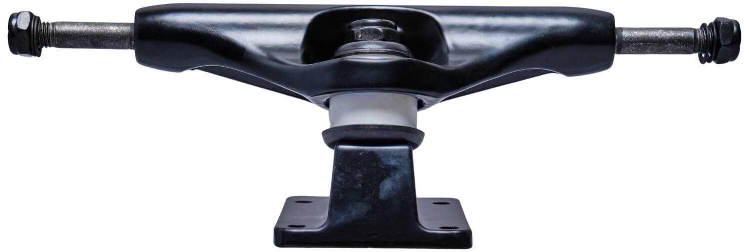 Close-up of the Essentials Black Skateboard Trucks, featuring metal axles and an aluminum hanger, highlighting the 90A bushings and mounting plate. The 144mm skateboard truck is centered against a plain white background.