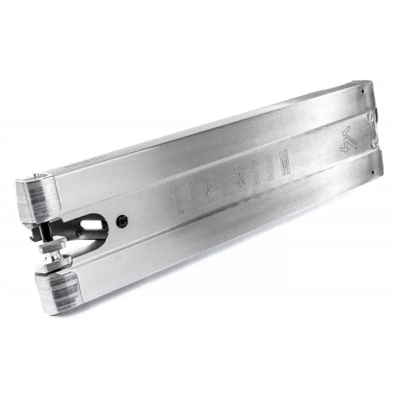 The Ethic DTC Lindworm V4 Raw Silver Stunt Scooter Deck, measuring 6.2" x 23.6", boasts a sleek design with the word "LINDWORM" elegantly engraved on its side. Its polished edges and precisely engineered mounting points for wheels and other components make it ideal for street riders seeking optimal performance.