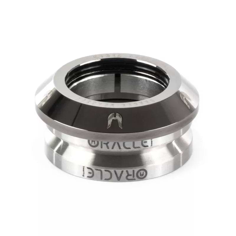 Close-up of a metallic scooter headset bearing, labeled "ETHIC," featuring a glossy chrome black finish against a white background. This Ethic DTC Oracle Integrated Stunt Scooter Headset incorporates an enhanced compression ring to minimize friction, ensuring top performance under diverse conditions.