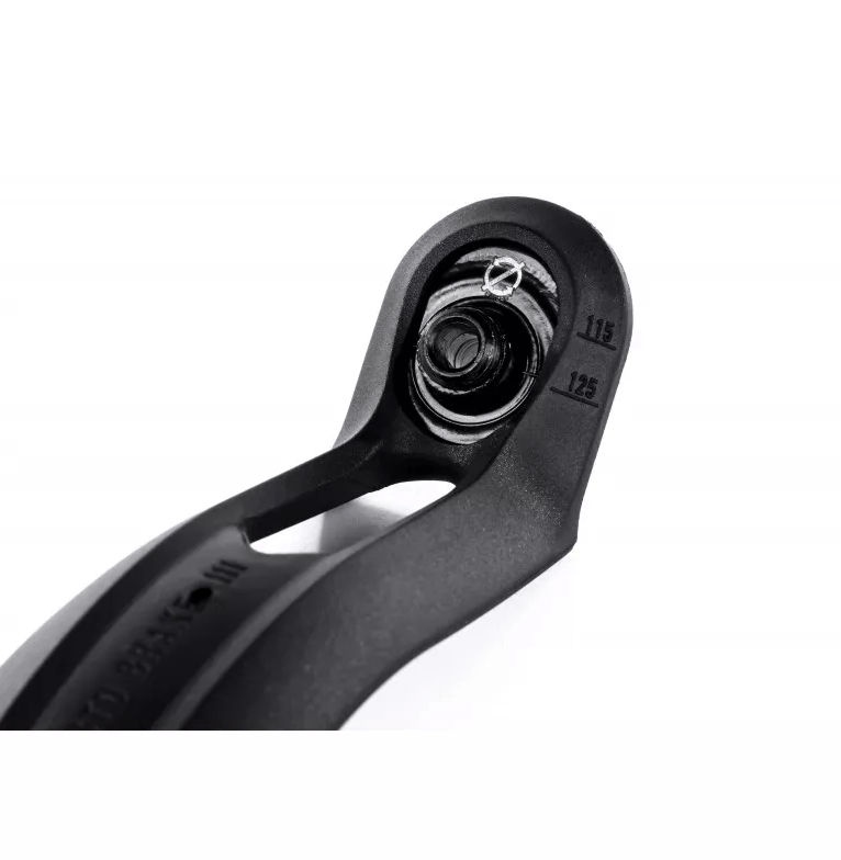 A close-up of a black Ethic DTC component, likely the 12 STD Nylon V3 Stunt Scooter Brake, displays markings "115" and "125" beside a screw. The sleek design stands out against a white background, highlighting its smooth, curved lines.