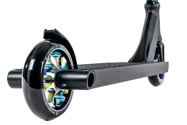 Close-up of a sleek and stylish Ethic DTC Pandora Complete Stunt Scooter (M) in Neochrome, showcasing its multicolored wheels. The deck is designed with a textured surface for enhanced grip, and the prominently visible front wheel contrasts beautifully against a white background.