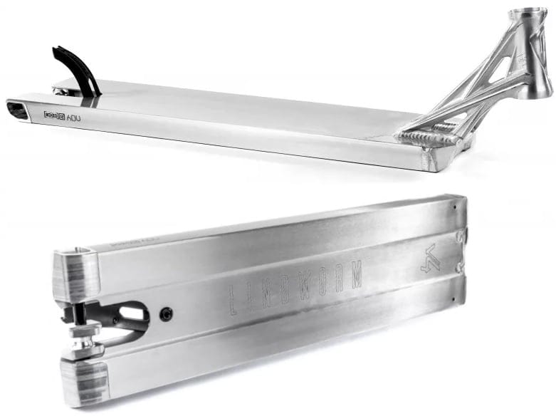 The Ethic DTC Lindworm V4 Raw Silver Stunt Scooter Deck, measuring 6.2" x 23.6", is displayed from two perspectives. The top view showcases its sleek metallic finish and angular design, while the bottom view accentuates the intricate geometry and a discreet stamped logo—ideal for any street rider's style.