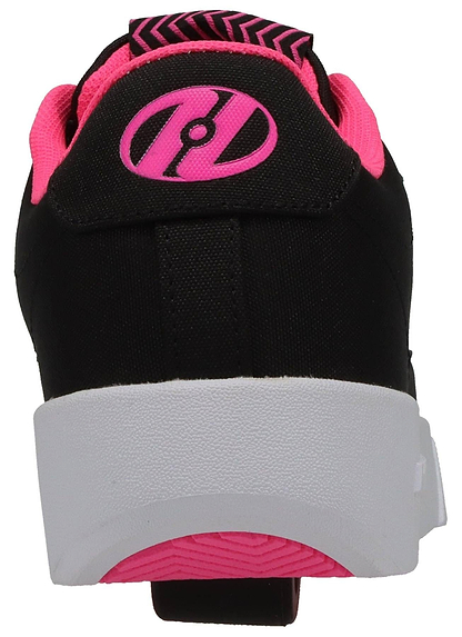 The image shows the back of Heelys Digilo Nylon Girls Shoes in black and pink, featuring a thick white sole, bright pink accents, a circular heel logo, and low-profile wheels similar to classic Heelys.